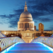 Millennium Bridge leads to Saint Paul’s Cathedral in central London at night