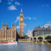 Big Ben and Houses of Parliament with boat in London, England, UK